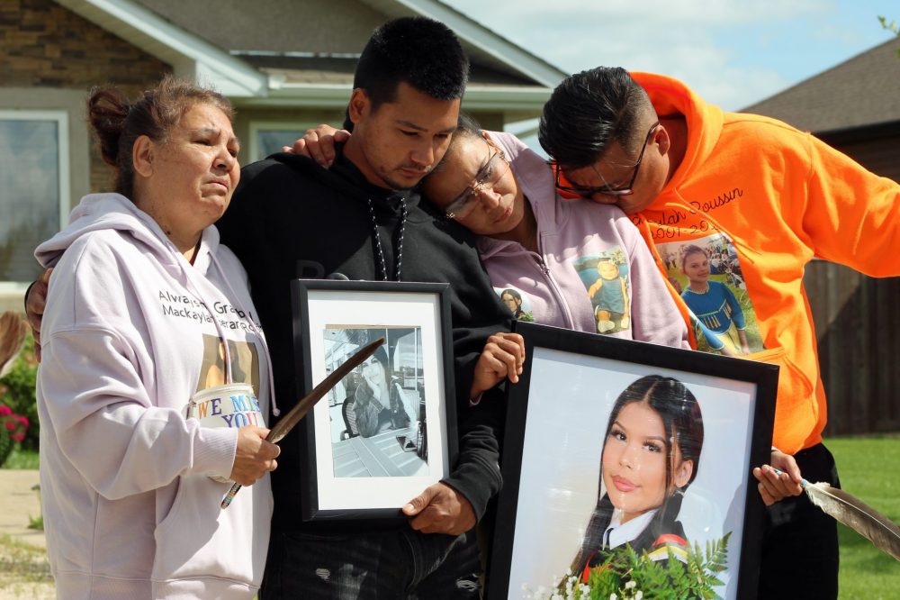 JORDAN ROSS THE CARILLON
The family of Mackaylah Gerard-Roussin, including her parents Melissa Roussin (second from right) and Kirby Gerard (right), mourn her death during a Friday vigil on Creekside Drive in Steinbach.