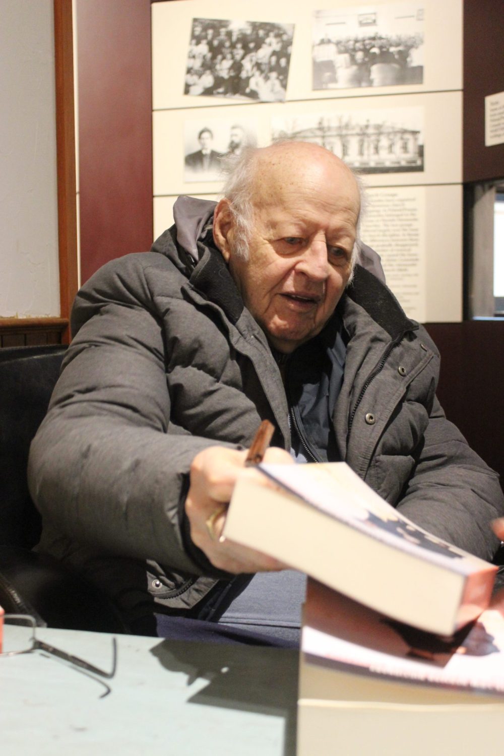 JORDAN ROSS CARILLON ARCHIVES
Jack Thiessen signs copies of his Low German dictionary at Mennonite Heritage Village in February 2019.