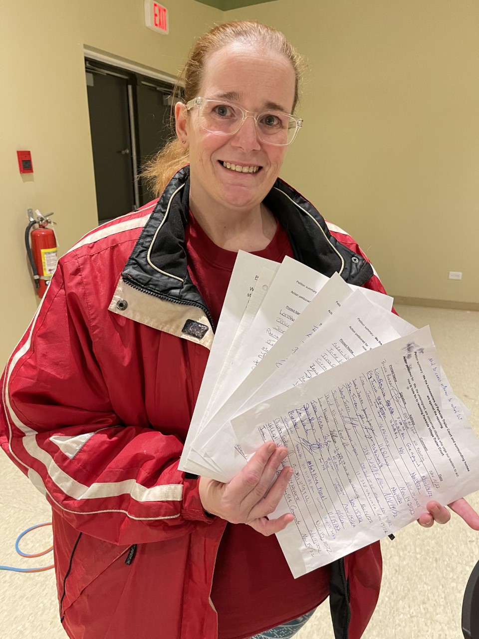 LORI PENNER THE CARILLON
Loretta Neustaeter shows off her five page petition.