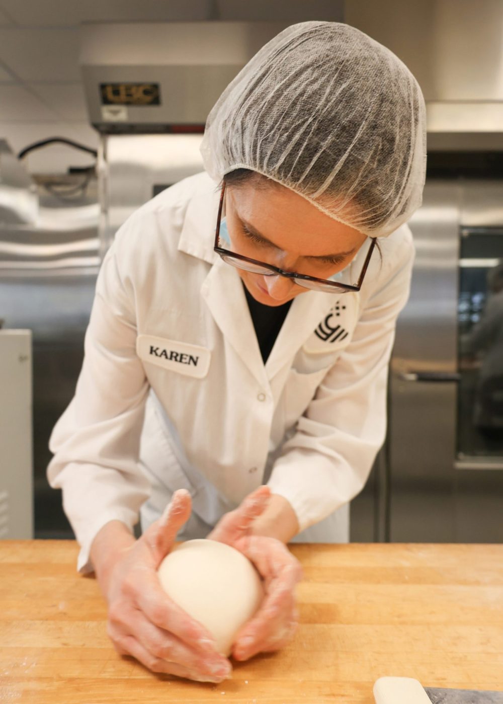 LEE HUSCROFT CEREALS CANADA
End products baking technical specialist Karen Pitura, just back from a Cereals Canada workshop in Africa, prepares a loaf of pan bread at the Winnipeg bakery.
