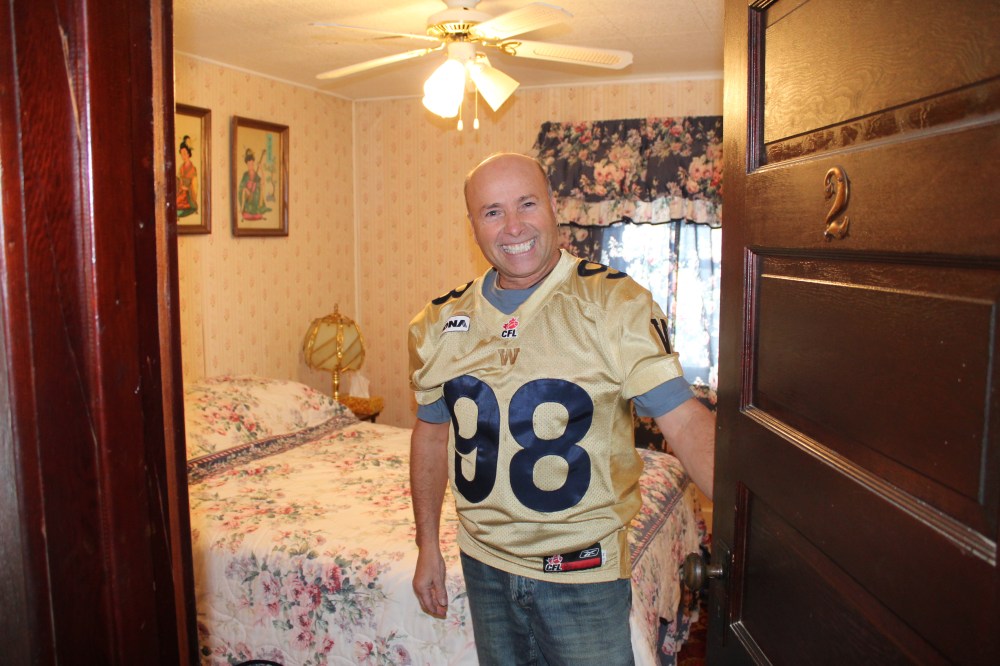 Holodryga shows off one of six hotel rooms located upstairs. (JORDAN ROSS | THE CARILLON)