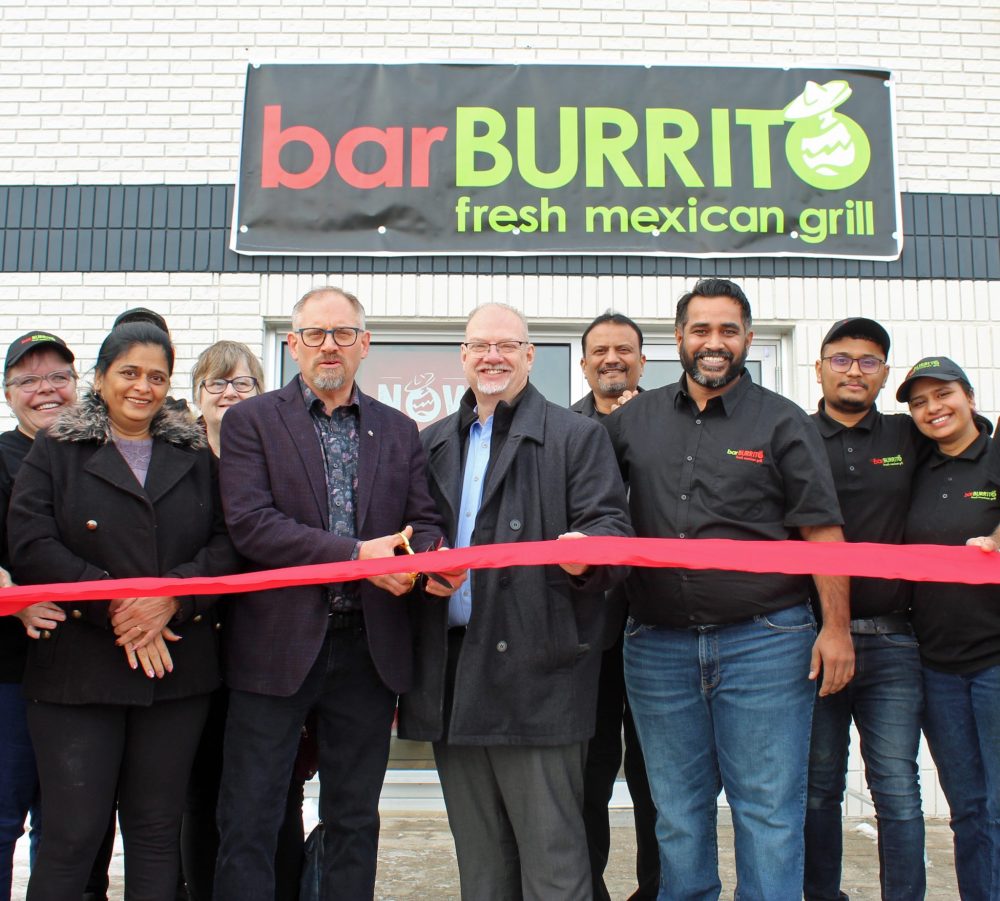 JORDAN ROSS THE CARILLON
Mayor Earl Funk and MLA Kelvin Goertzen cut the ribbon at BarBurrito, accompanied by owner Surendra Badwal (third from right) and manager Vishal Patel (second from right).