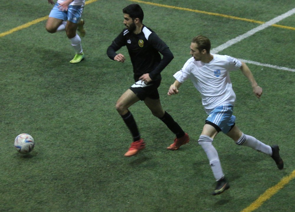 A Niverville Force player looks to turn past a Kucame B FC defender in the first half of the Force's 4-1 victory Jan. 7. (Cassidy Dankochik)
