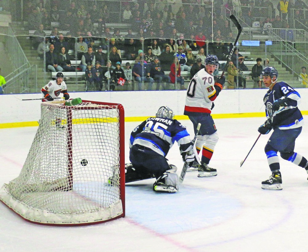Ben Whitford watches as Carson Reed's shot hits the back of the net for the first Nighthawks goal scored at the Niverville Community Resource and Rec Centre. (Cassidy Dankochik The Carillon)