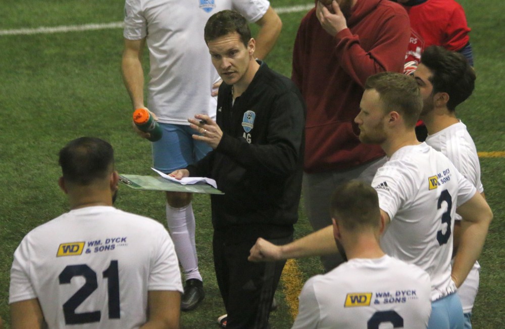 Andry Giesbrecht gives his team some half-time pointers during a MMSL second division indoor match. (Cassidy Dankochik The Carillon)