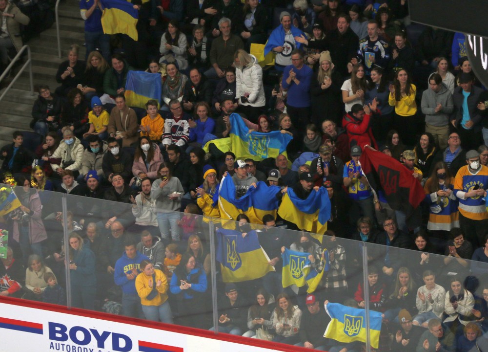 Ukrainian fans celebrate a first period goal. (Cassidy Dankochik The Carillon)