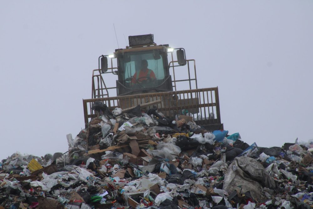 GREG VANDERMEULEN THE CARILLON
A landfill employee moves and compacts trash as the current cell nears capacity.