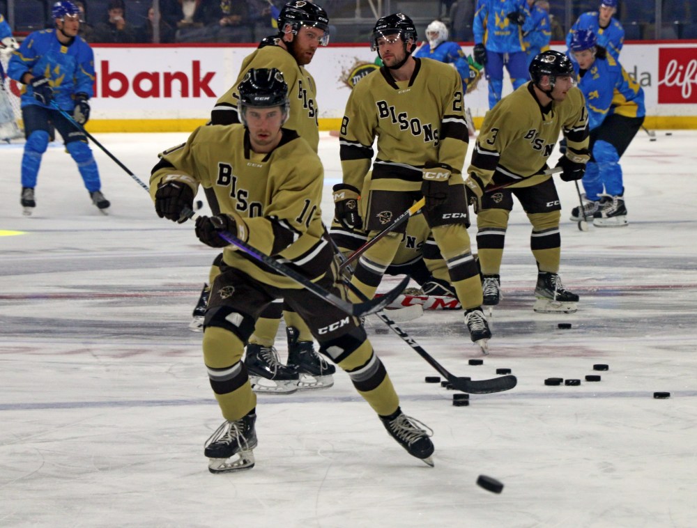 Devon Skoleski warms up on the Canada Life Centre ice surface. The third-year forward from St Adolphe is thriving for the Bisons this season, scoring 21 points in 17 games this season. Skoleski scored his team's only goal in the exhibition match against Ukraine. (Cassidy Dankochik The Carillon)