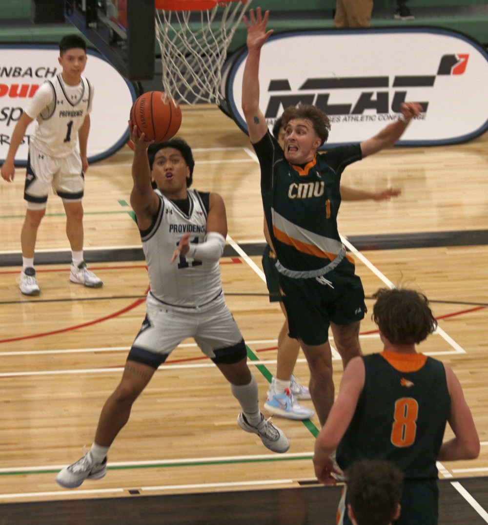 Raphael Rhys Maestre goes up for a layup against CMU. Providence head coach Pierre Dubreuil said after the game he thought the first-year shooting guard had his best game as a Pilot, including a dagger three-pointer. (Cassidy Dankochik The Carillon)