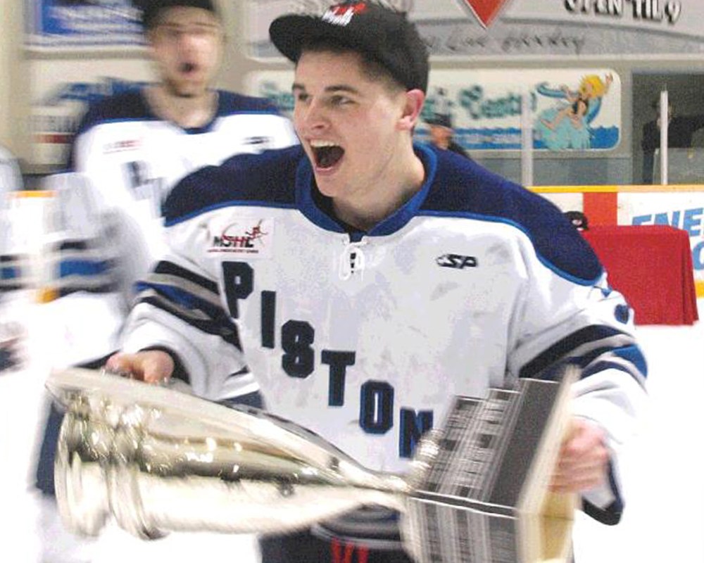 Jubilant playoff MVP, goaltender Corey Koop, with the Turnbull Cup at the Centennial Arena after he and his Steinbach Pistons teammates outsted the top-ranked Dauphin Kings in the sixth game of the Manitoba Junior Hockey League finals, to earn a ticket to the Western Canada Cup in Nanaimo, BC.