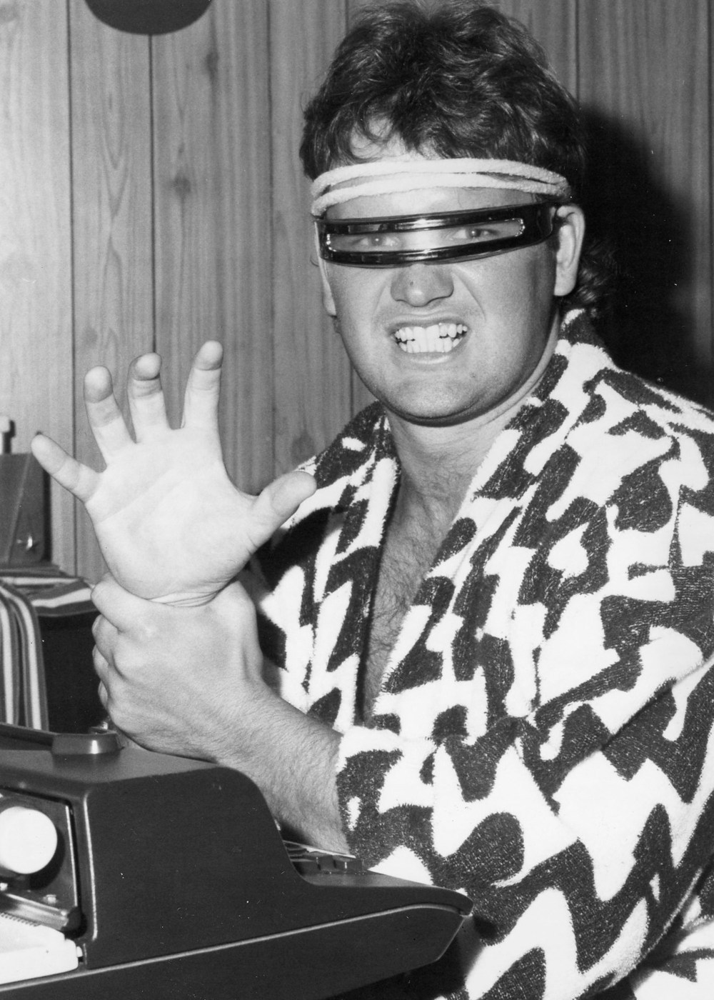 Striking his best Baron von Raschke, aka “The Claw,” pose, James Loewen, who celebrated his 60th birthday earlier this month, launched “As I See It” in The Carillon with a column on professional wrestling in July of 1985.