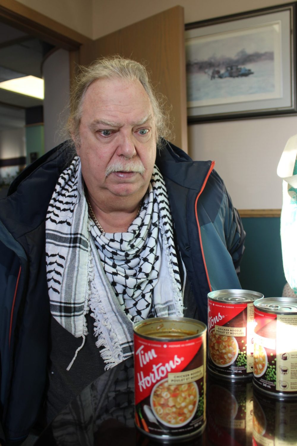 GREG VANDERMEULEN THE CARILLON
Claude Caron looks down at the can of soup he opened only to discover a fly.