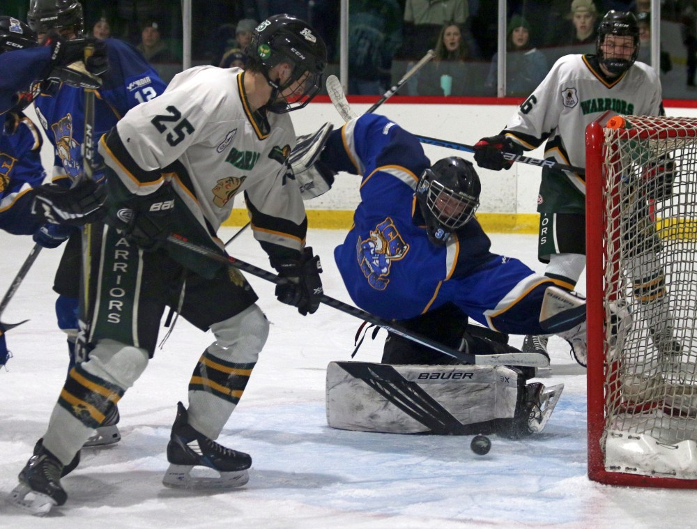 Thomas Maynard scores during the first period of St Malo's 9-4 victory against Arborg in the CRJHL semi-finals. Maynard finished with six points on the night, and Arborg starting goaltender Tre Strachan was forced to leave the game due to injury after falling awkwardly during this play. (Cassidy Dankochik The Carillon)