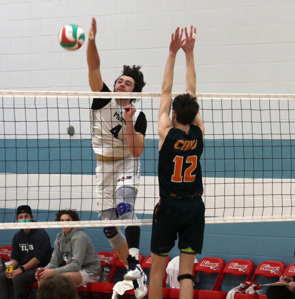 Noah Boschman flies for a kill during the first set of Providence's straight sets championship victory over CMU. (Cassidy Dankochik The Carillon)