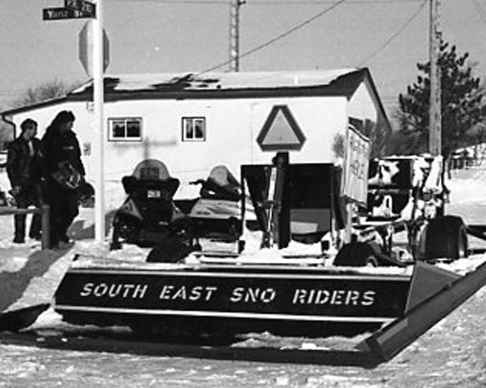 CARILLON ARCHIVES
The Southeast Sno Riders trail groomer, built by Norm and Ken Ruta, provides a perfect platform for a registration desk for snowmobilers signing up to participate in the club’s second annual fundraising poker derby.