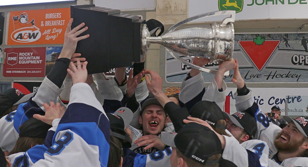 Steinbach Pistons captain Dawson Milliken is mobbed by teammates after accepting the Turnbull Cup. Milliken was also named the MJHL's playoff MVP. (Cassidy Dankochik The Carillon)