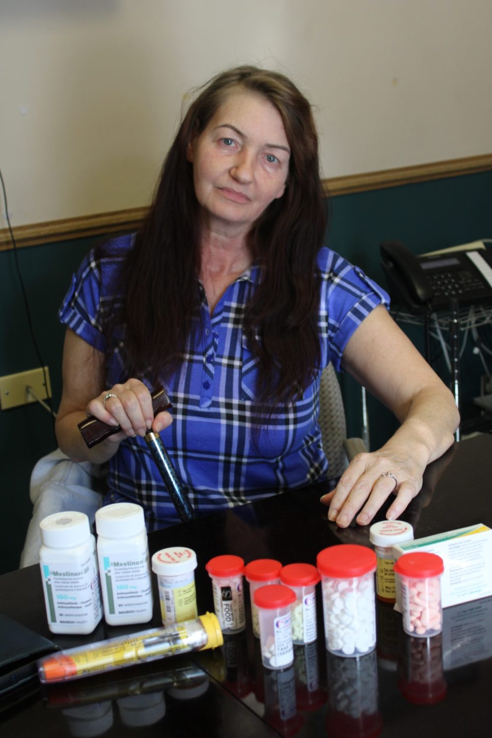 GREG VANDERMEULEN THE CARILLON
Charlene Gardiner was diagnosed with myasthenia gravis on March 13. Posing with an impressive array of new drugs she’ll take in an effort to force the disease into remission, she’s praising the community for being a support for her before and since her diagnosis.