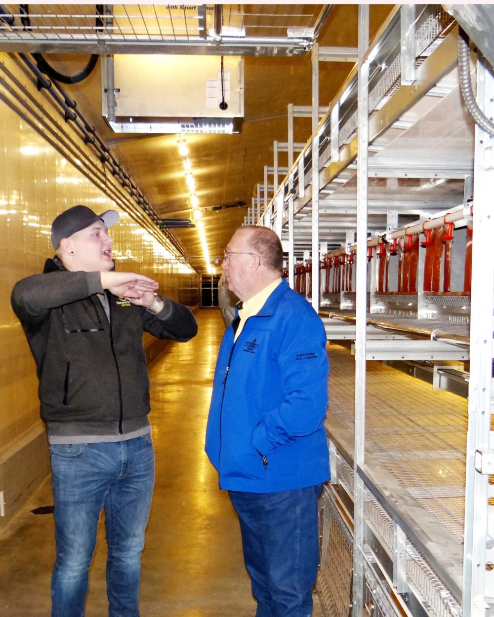 WES KEATING THE CARILLON
Harley Siemens describes the workings of the new aviary layer barn system to Manitoba Agriculture Minister Ralph Eichler, during a March, 2019 tour of Siemens Farms at Rosenort.
