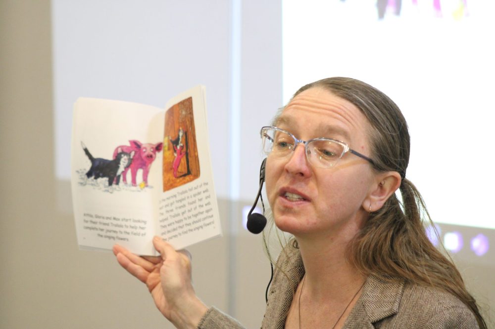 GREG VANDERMEULEN THE CARILLON
Anndrea Hermann reads during the Jake Epp Library story time on Friday.