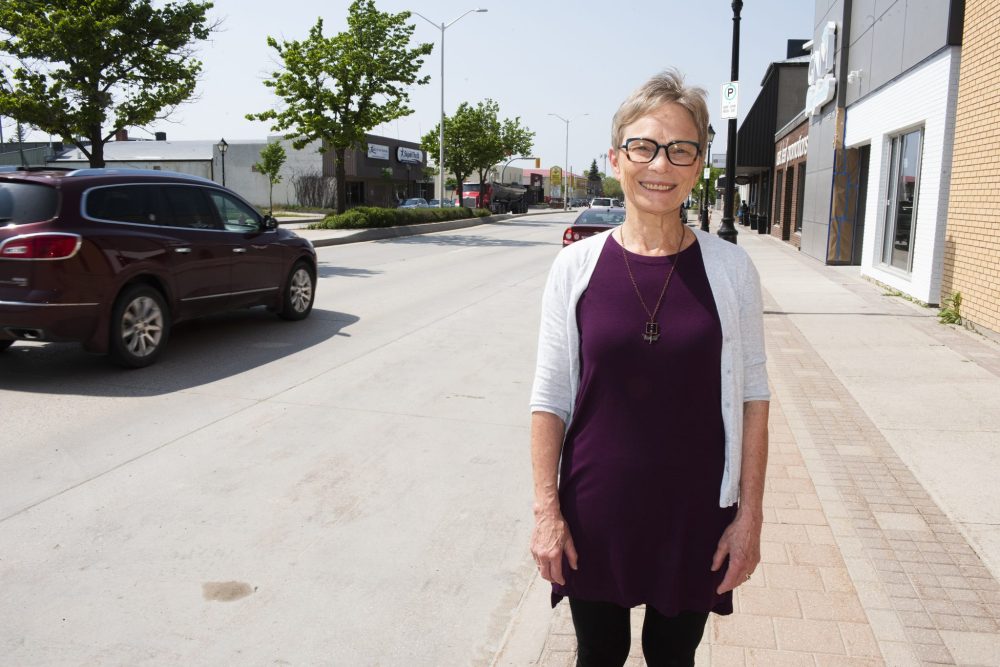 SVJETLANA MLINAREVIC THE CARILLON
Gay Boese from the South East Equity Coalition stands on Main Street in Steinbach, one of the city’s busiest streets.