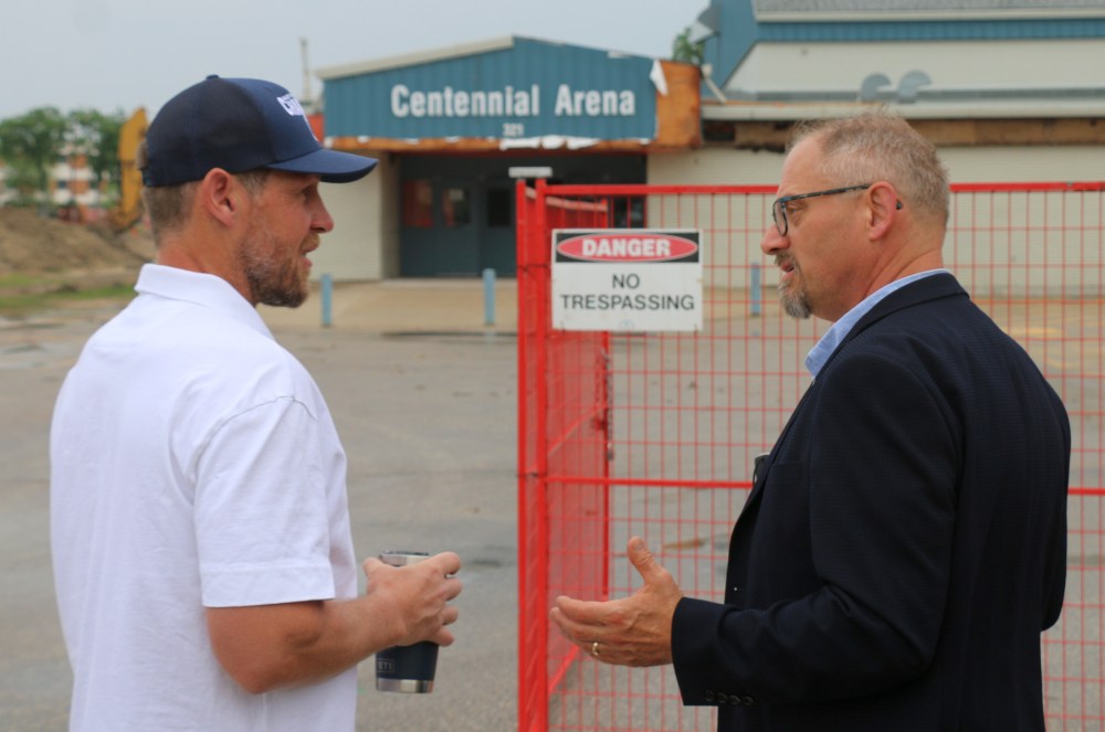 Steinbach Mayor Earl Funk and Pistons' head coach and general manager Paul Dyck chat before the demolition of the Centennial Arena begins. (Cassidy Dankochik The Carillon)