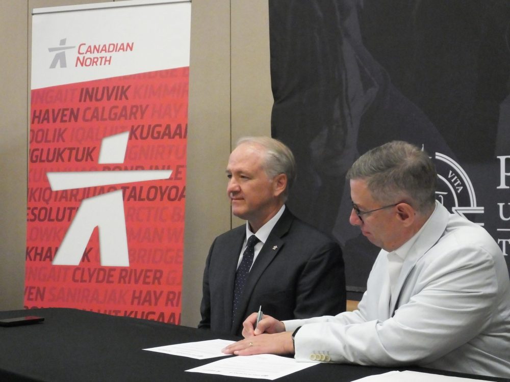 CHRIS GAREAU THE CARILLON
Canadian North Airlines president & CEO Michael Rodyniuk and Providence University College president Dr. Kent Anderson sign the letter of intent June 8 to bring Inuit people from across northern Canada to Otterburne for pilot training.