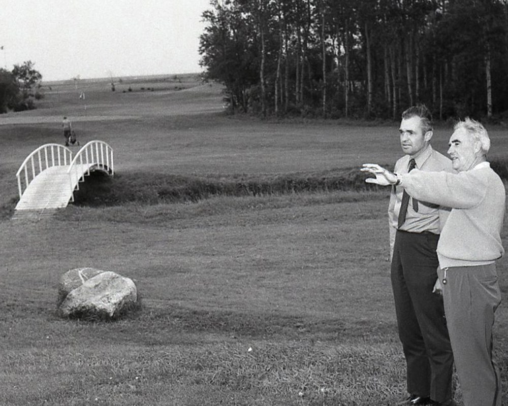 Toronto golf course architect C.E (Robbie) Robinson points out features of the picturesque seventh hole to Steinbach Fly-In Golf Club executive member Peter Guenther during a visit to the course in 1970.