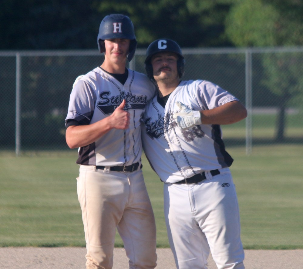 Cody Gunderson and Brady Papineau shared a smile on first base while Pembina Valley was in the middle of a pitching change. Both players would come around to score later in the inning. (Cassidy Dankochik The Carillon)