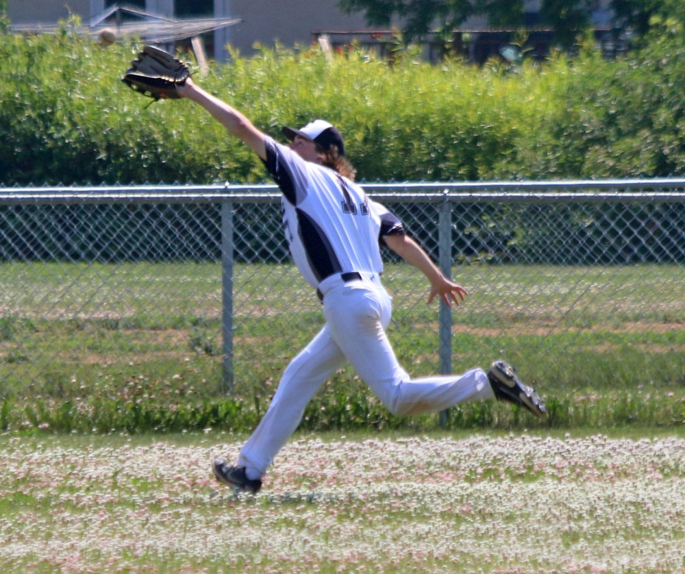 Connor Tallaire makes a great running catch to prevent a double in the fields at Ile des Chenes. (Cassidy Dankochik The Carillon)