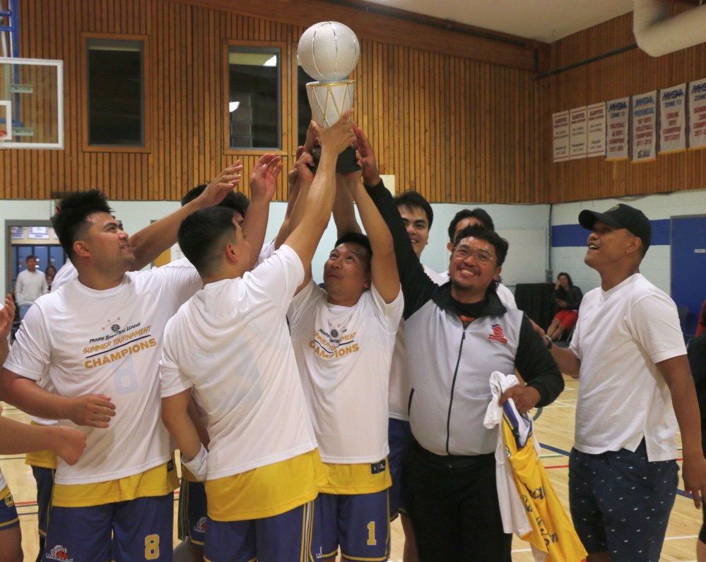 Metroball hoist the trophy recognizing them as the winners of PBL's summer tournament. (Cassidy Dankochik The Carillon)