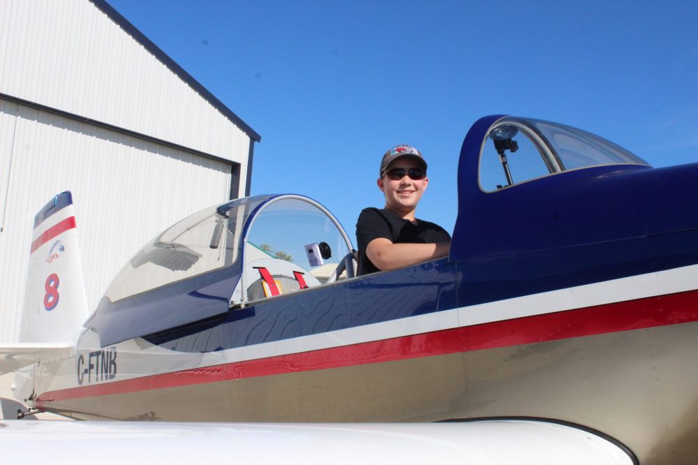 CHRIS GAREAU The Carillon
Adam Peters, all of 14 years old, sitting on cushions to boost him up in his new plane that he is competing with during the Canadian National Aerobatic Championships in Steinbach. His YouTube channel Turned N Banked is seeking sponsors to help get more young people into aviation — though maybe not quite as young as Adam did when he was 12.
