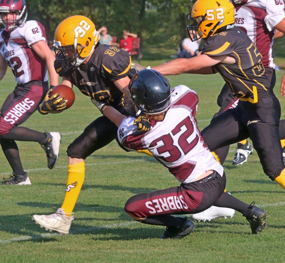 Steinbach's Nigel Reader looks to shake off a Springfield tackler during the the two team's pre-season game. (Cassidy Dankochik The Carillon)
