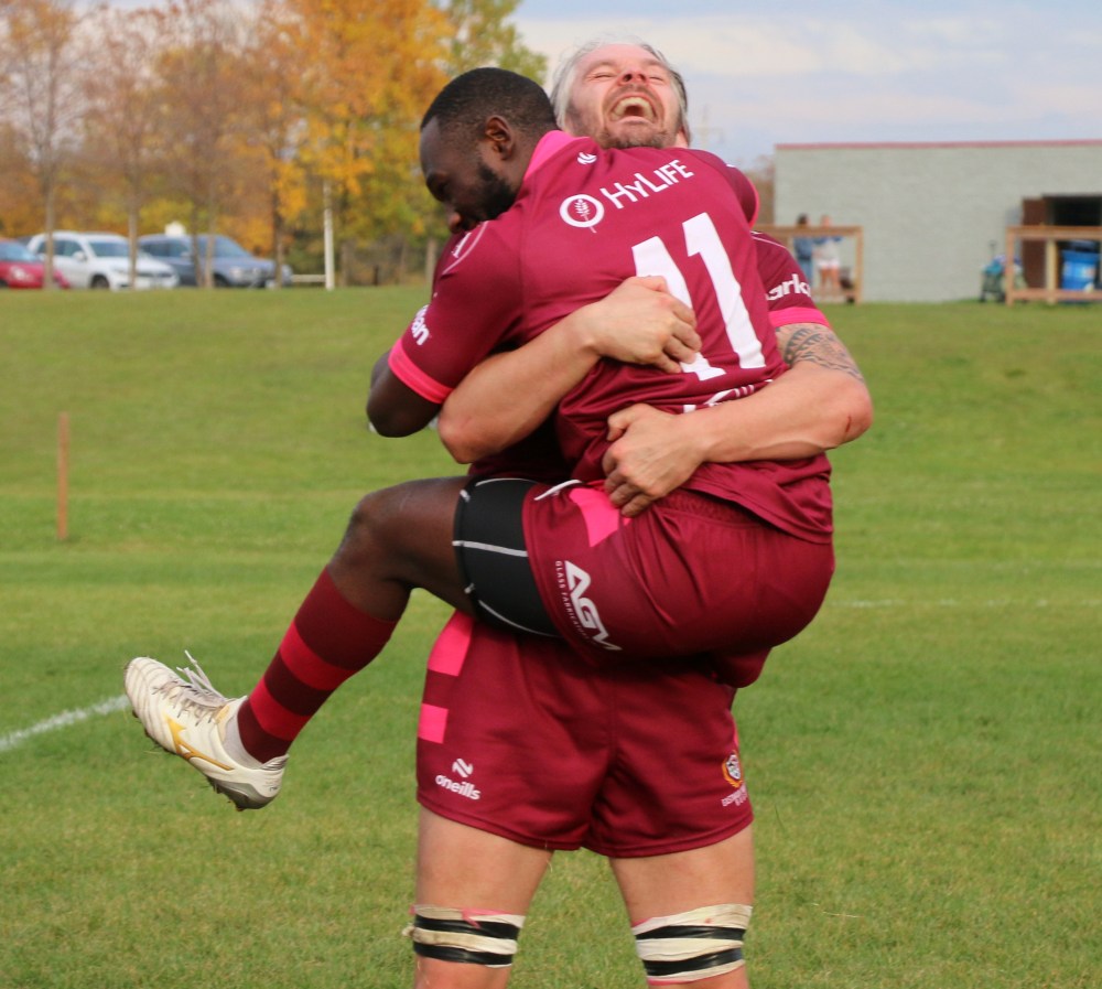 Ioan Evans hugs a teammate after the final whistle was blown. (Cassidy Dankochik The Carillon)