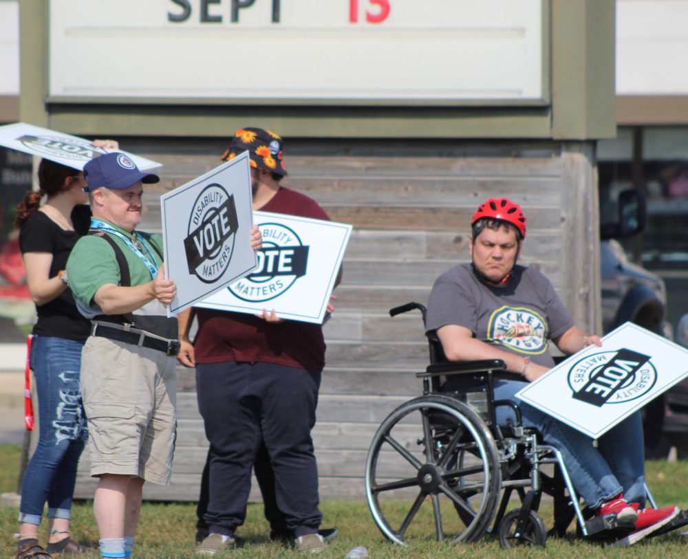 CHRIS GAREAU THE CARILLON
Supporters for disability rights get honks of support from passing motorists at Brandt and Main Streets as part of a province-wide rally by Disabilities Matters Vote Sept. 19 to get voters thinking about their issues ahead of the Oct. 3 election.