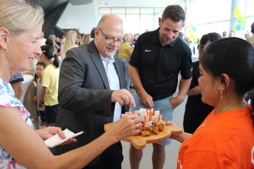 GREG VANDERMEULEN THE CARILLON
Steinbach MLA Kelvin Goertzen (centre) was among those enjoying the tasty pork samples.