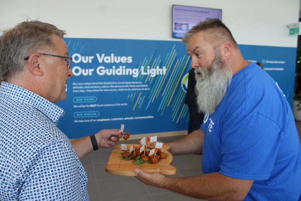 GREG VANDERMEULEN THE CARILLON
Left, CEO Grant Lazaruk enjoys a sample offered up by a HyLife driver trainer Thom Doerksen during opening celebrations.