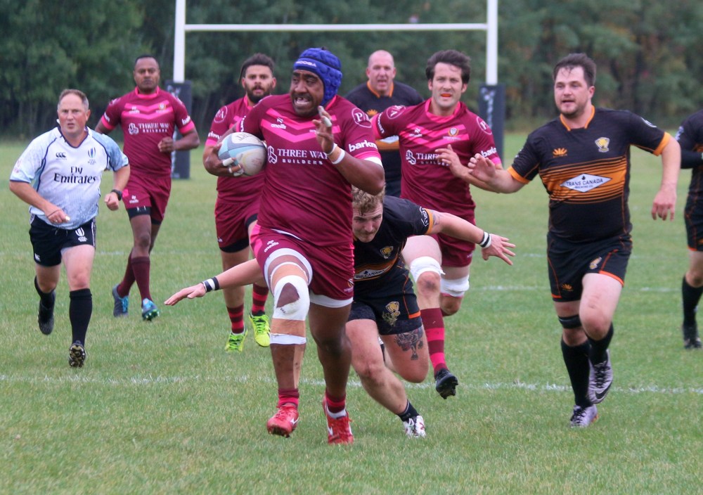A Warriors player breaks free for the first try of the championship final. (Cassidy Dankochik The Carillon)