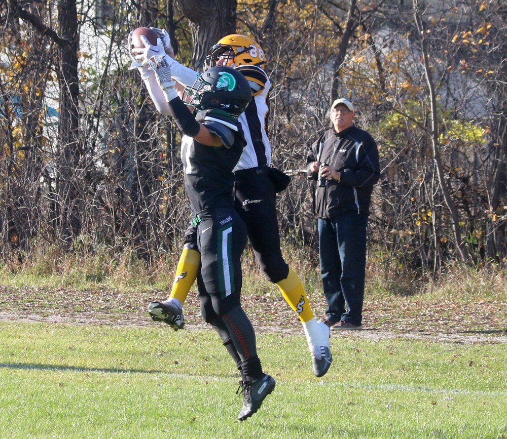Jackson Penner stole this interception away from a Vincent Massey defender in the end zone, scoring the opening points of the game. (Cassidy Dankochik The Carillon)