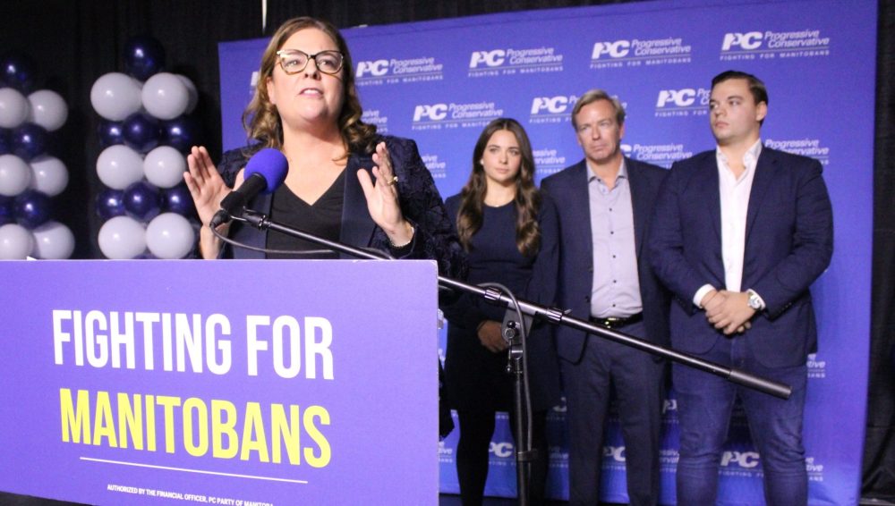 GREG VANDERMEULEN THE CARILLON
PC Leader Heather Stefanson speaks to PC candidates and supporters Tuesday night in Winnipeg as her husband Jason and children Tommy and Victoria look on. Stefanson stepped down after seeing her seat count reduced to 22.
