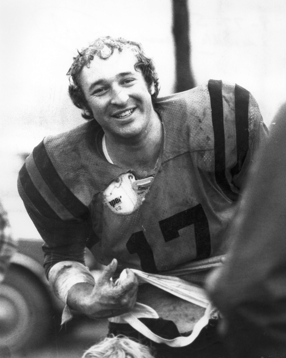 A little worse-for-the wear, Grant McVicar is all smiles as he retires to the bench for uniform repairs, watching Wheelers’ teammate Les Kehler carry the ball in Steinbach’s 25-9 win over Landmark in the 1977 Rural Intermediate Nine-Man Football League championship game.