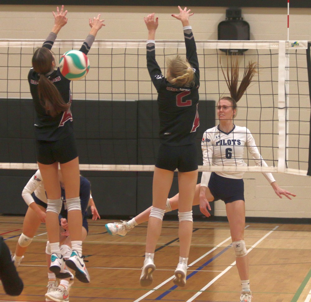 Serena Algera watches as her kill attempt splits the Assiniboine defense. (Cassidy Dankochik The Carillon)