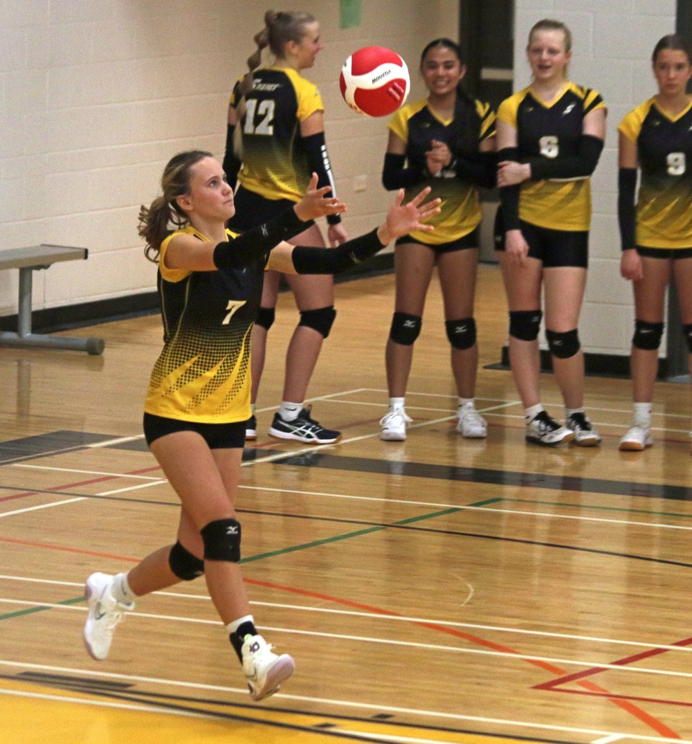 Oliva Unrau sets up to serve for the SRSS Sabres' girls junior varsity volleyball team. The Sabres are undefeated so far this season, thanks in large part to their dominance serving. (Cassidy Dankochik The Carillon)