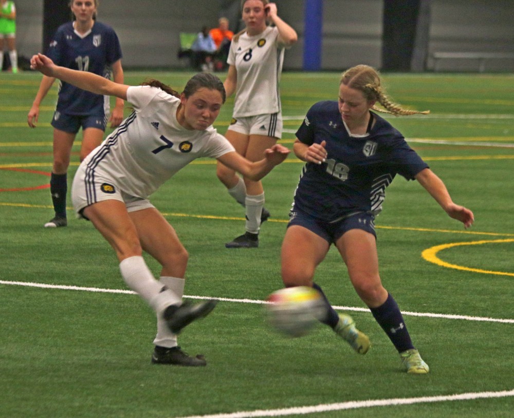 Ste Genevieve's Emilie Dornez clears a ball during the Brandon Bobcats' 2-1 championship victory over Providence in the Manitoba Colleges Athletic Conference women's championship. (Cassidy Dankochik The Carillon)
