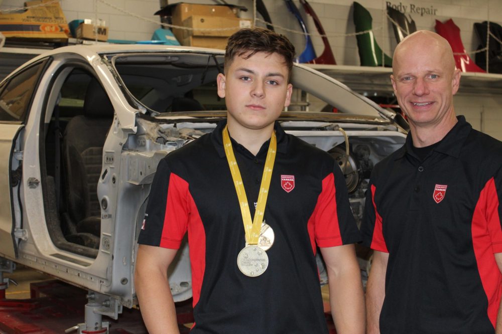 Chris Gareau The Carillon
James Bartel (left) with the car he is practising on in the Steinbach Regional Secondary School shop. The Grade 12 student won the Skills Canada competition and is off to Lyon, France with teacher Jessy Unrau (right) to compete in Autobody Repair against the world's best high school and college students.