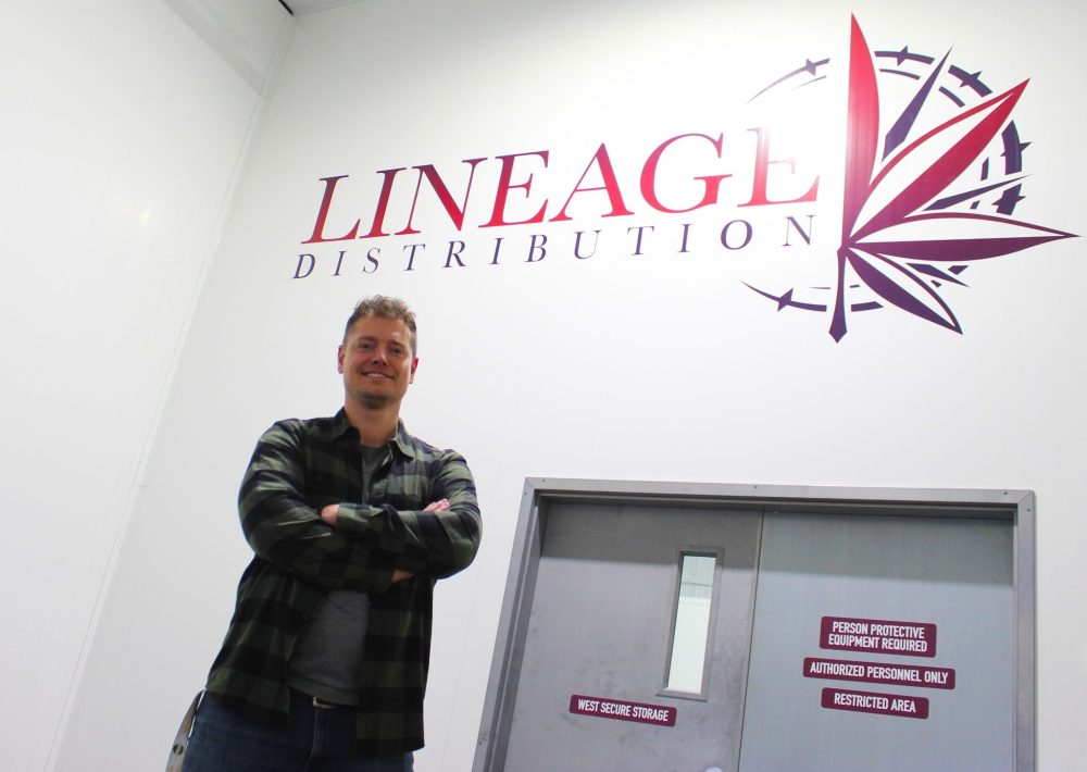 By Chris Gareau
CHRIS GAREAU THE CARILLON
Lineage Distribution president and CEO Graham Taylor under the new logo at his expanded facility in Niverville.