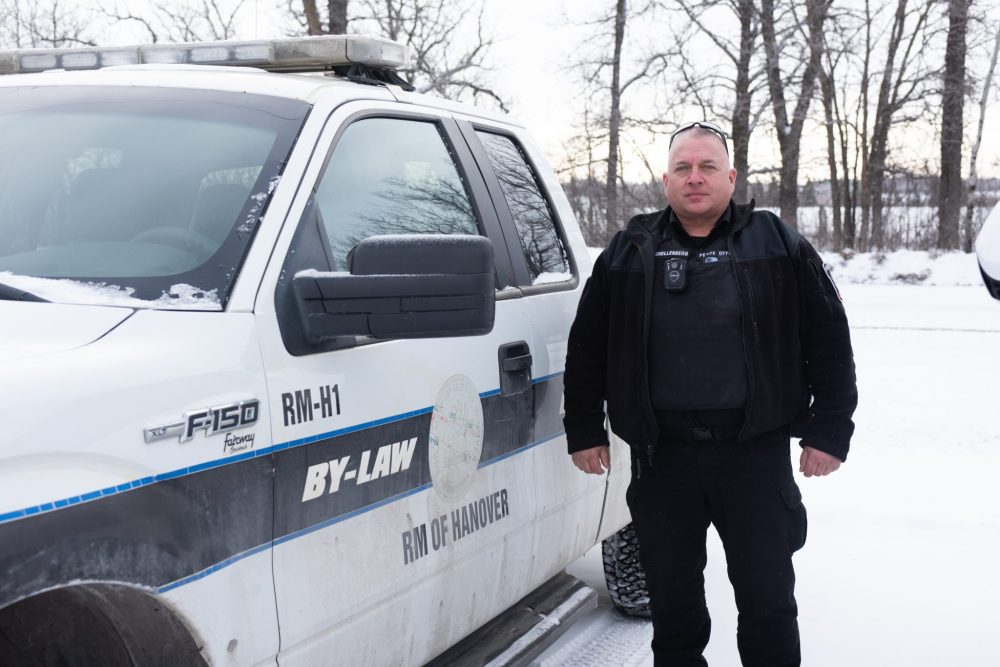 SVJETLANA MLINAREVIC THE CARILLON
Community Safety Officer Trevor Schellenberg stands by the bylaw enforcement vehicle on Jan. 18.