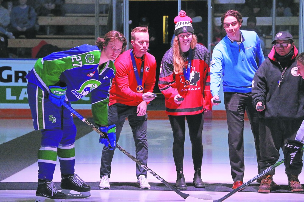 Cassidy Dankochik The Carillon
St Adolphe’s Avery Pickering (Team Canada Jersey) was honoured before the start of a Winnipeg Ice game against Swift Current Feb. 15 after winning a gold medal with Team Canada at the U18 championships. It was the perfect opponent to honour Pickering, as she got to drop the ceremonial puck for her brother and captain of Swift Current, Owen Pickering, who was named a division all-star in the WHL in 2023.