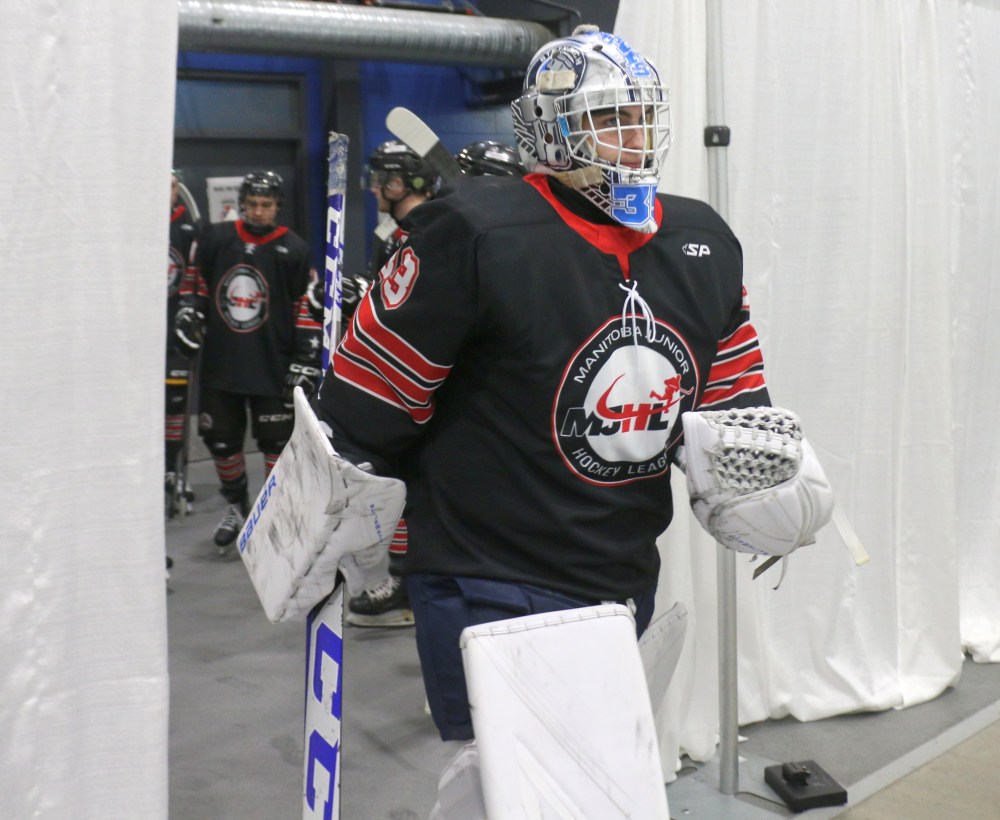 Steinbach Pistons goalie Cole Plowman walks onto the ice at the Seven Oaks Sportsplex to start a game at the MJHL/SJHL showcase. Plowman got the start on Jan. 30 for an MJHL U20 team. (Cassidy Dankochik The Carillon)