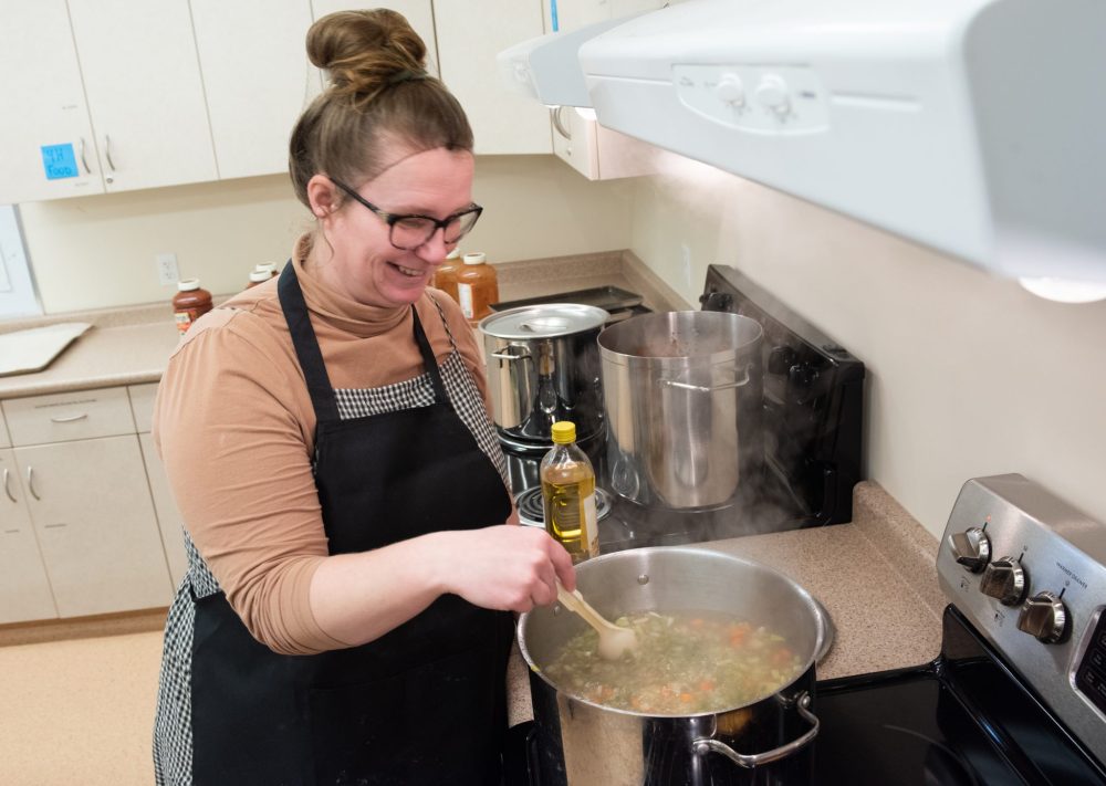 SVJETLANA MLINAREVIC THE CARILLON
Grunthal's Share a Bowl Soup Kitchen volunteer Lize Van Oort stirs a pot of vegetable soup for the opening day of the soup kitchen, Feb. 14, 2024. The soup kitchen will be open once a month at Elim Mennonite Church.