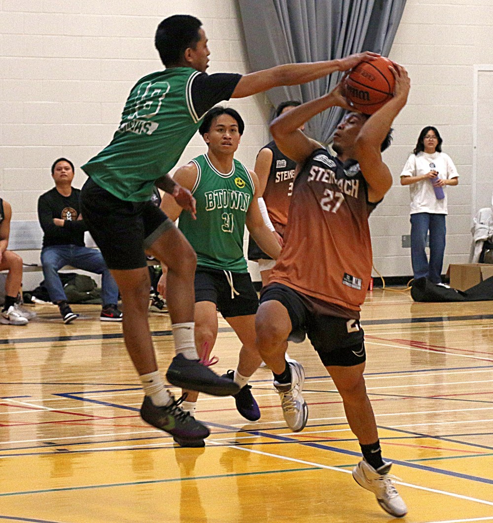 Edward Diones has his shot blocked by a defender during the FBA Steinbach exhibition match. (Cassidy Dankochik The Carillon)